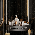 Grey suction cup shower caddy holding toiletries in a luxury marble bathroom
